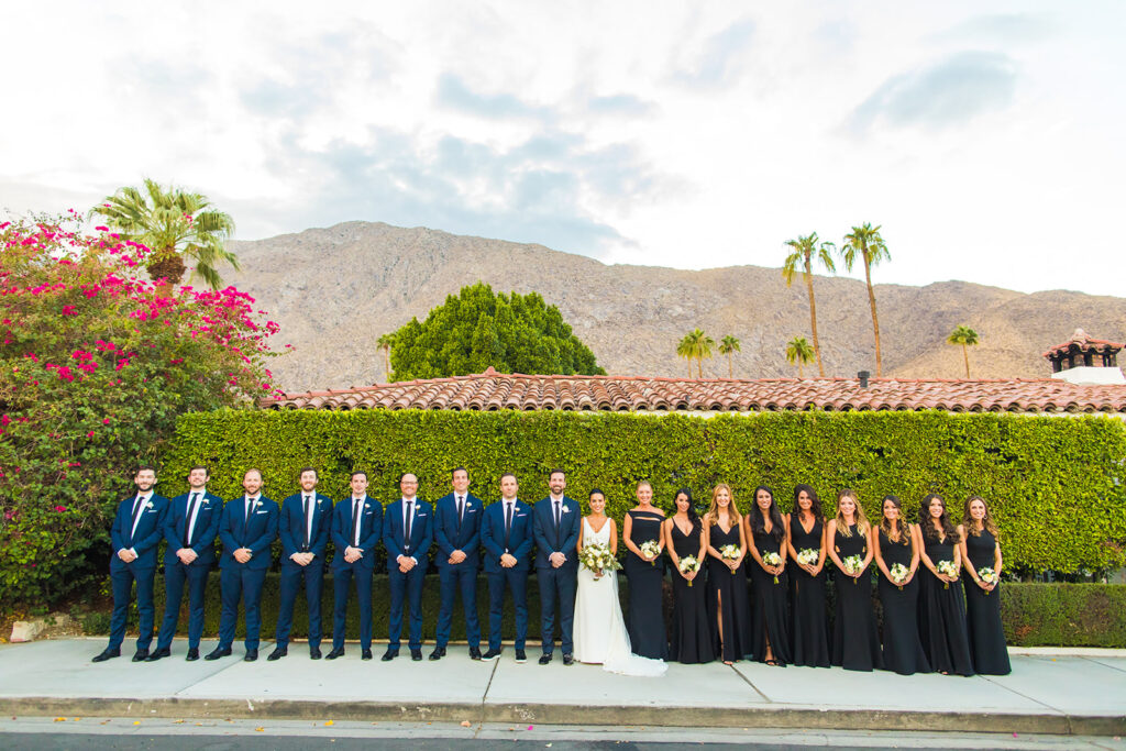 wedding party posed outside Avalon Palm Springs wedding venue